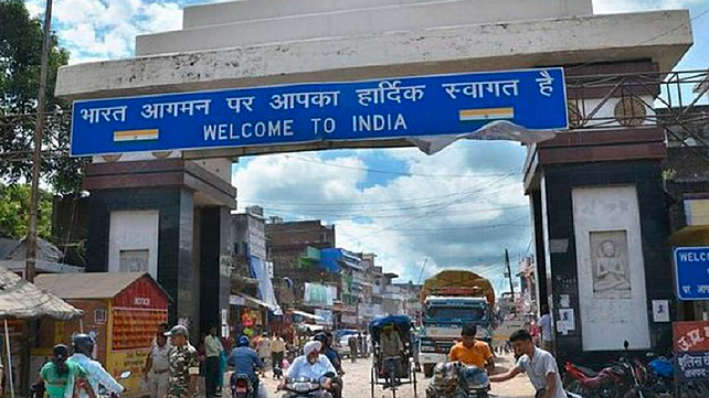 Signboard informing start of India border