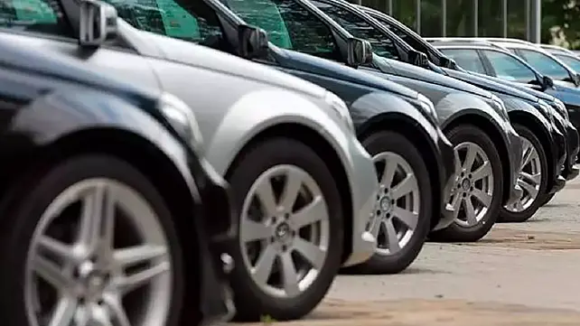 Cars parked at a dealership for sales Cars parked at a dealership for sales