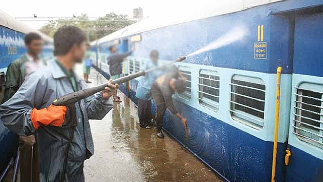 Manual train cleaning in India