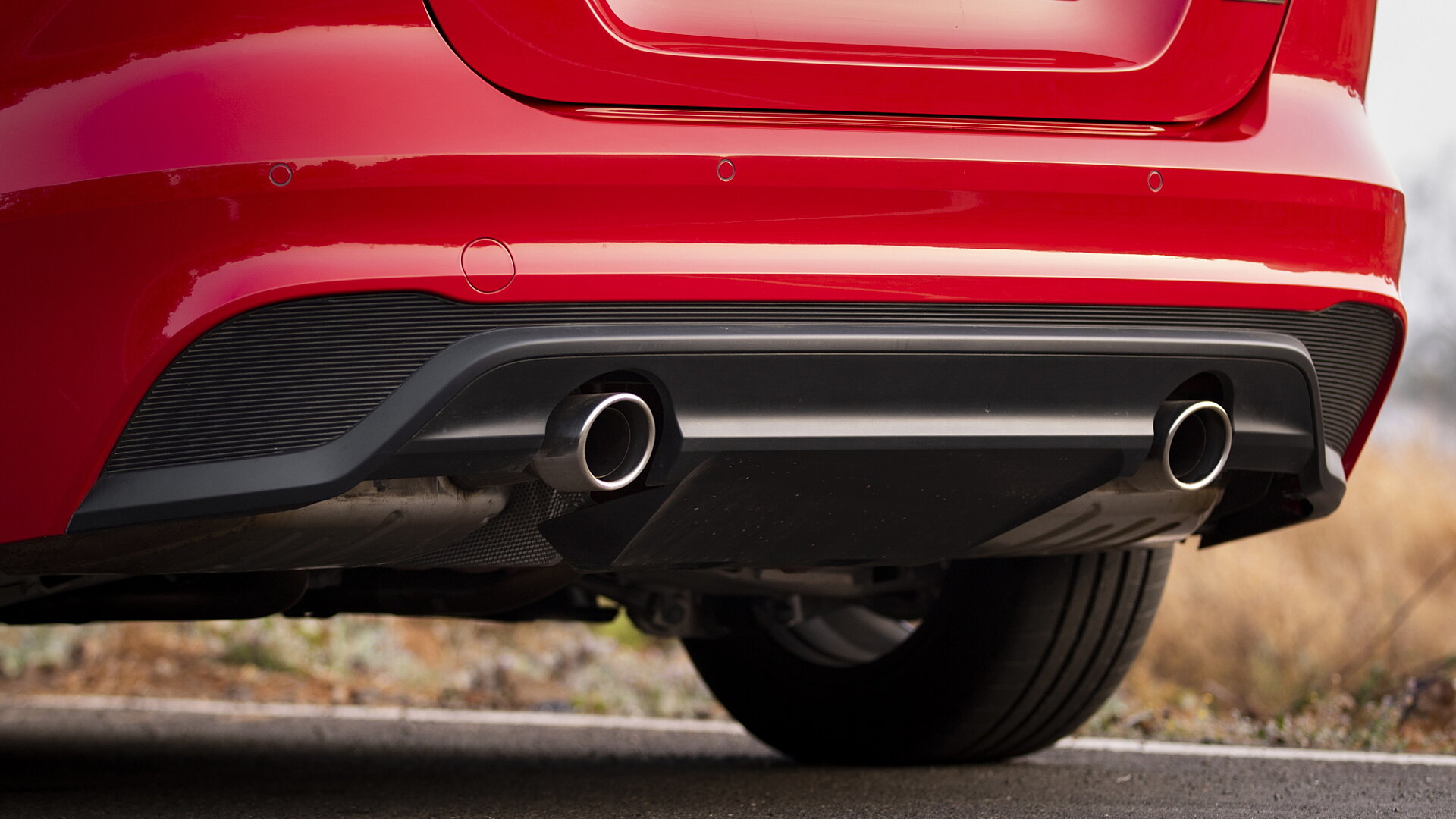 XE Exhaust Image, XE Photos in India - CarWale