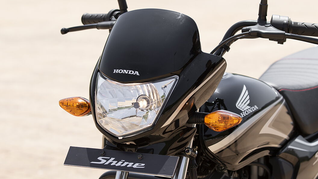 Honda shine front light best sale cover price