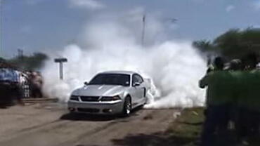 A well-executed burnout in a Ford Mustang