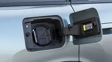 मिनी कंट्रीमैन इलेक्ट्रिक फ़्यूल लिड खोलें