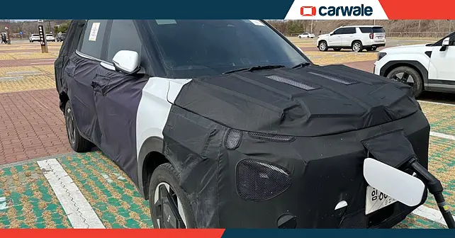 Kia Carens EV Spied at a Charging Station: Launch Soon?