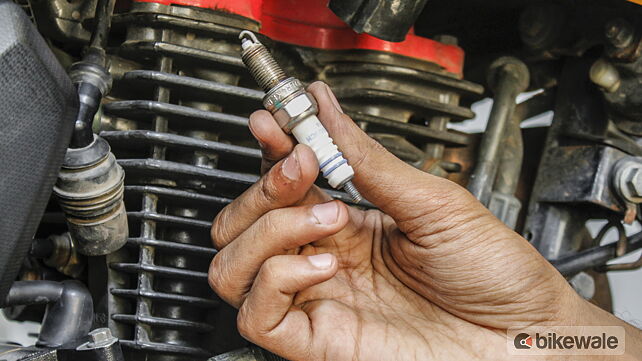 Clean or replace a spark plug