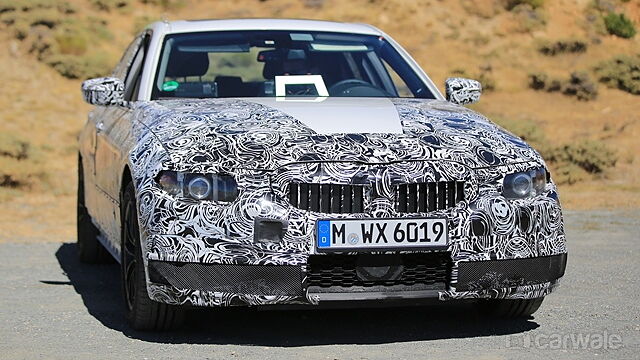 Camouflaged next-gen BMW 3 Series reveals new design cues