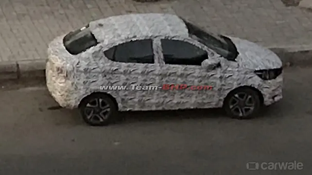 Tata Tigor facelift spied testing again with Tata Altroz inspired face Tata Tigor facelift spied testing again with Tata Altroz inspired face