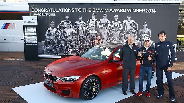BMW honours 2014 MotoGPworld champion Marc Marquez with an M4 Coupe BMW honours 2014 MotoGPworld champion Marc Marquez with an M4 Coupe