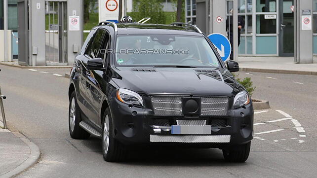 The 2015 Mercedes ML-Class spied with minimal camouflage
