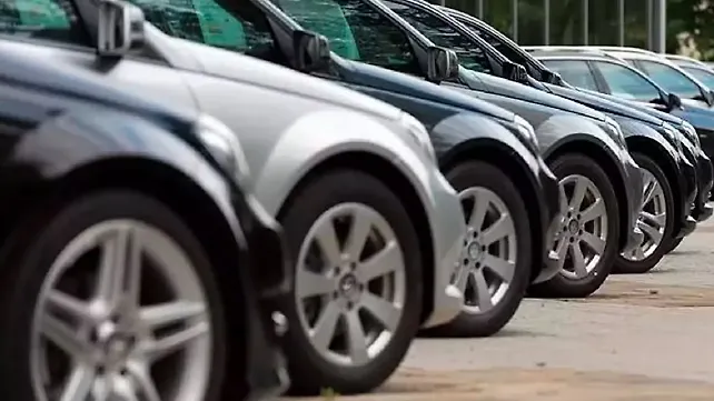 Cars parked at a dealership for sales Cars parked at a dealership for sales
