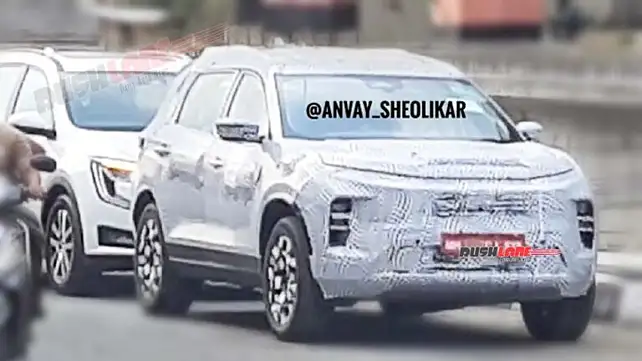 Tata Safari facelift spotted alongside XUV700; to get new headlights Tata Safari facelift spotted alongside XUV700; to get new headlights