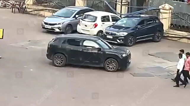 Maruti eVX spied again; this time at an EV charging station