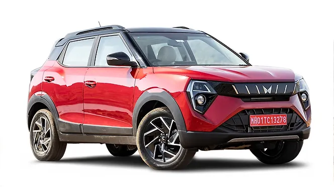 A Mahindra XUV 3XO on an open road, emphasizing its bold SUV design.